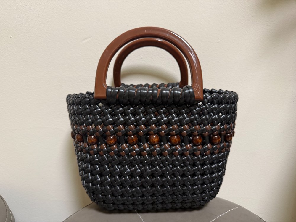 Woven cord, wooden beads, resin handle